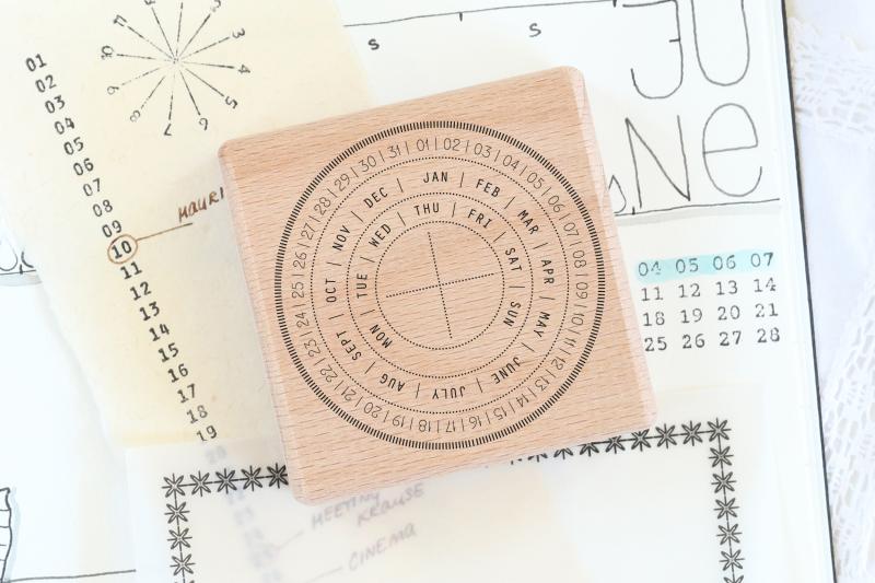 rubber stamp calendar as circle for every day for bullet journal and planner mounted on wood